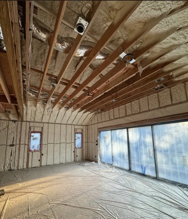 Interior walls and ceiling insulated with spray foam during new construction in Canterbury
